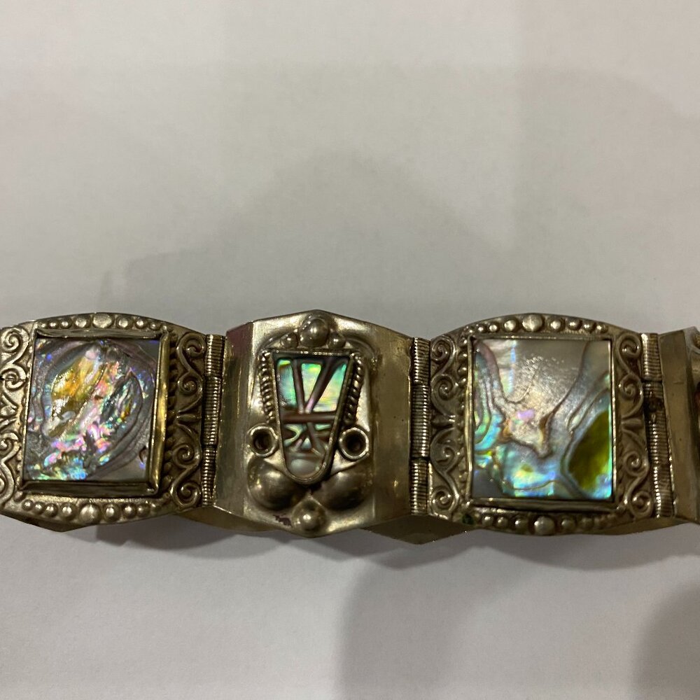 This is a vintage Hecho En Mexico Alpaca Panel abalone shell bracelet